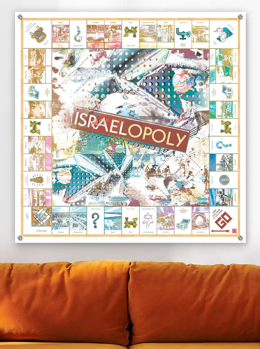 Israelopoly Israel-inspired board game artwork printed on metal wall art above a velvet orange couch.