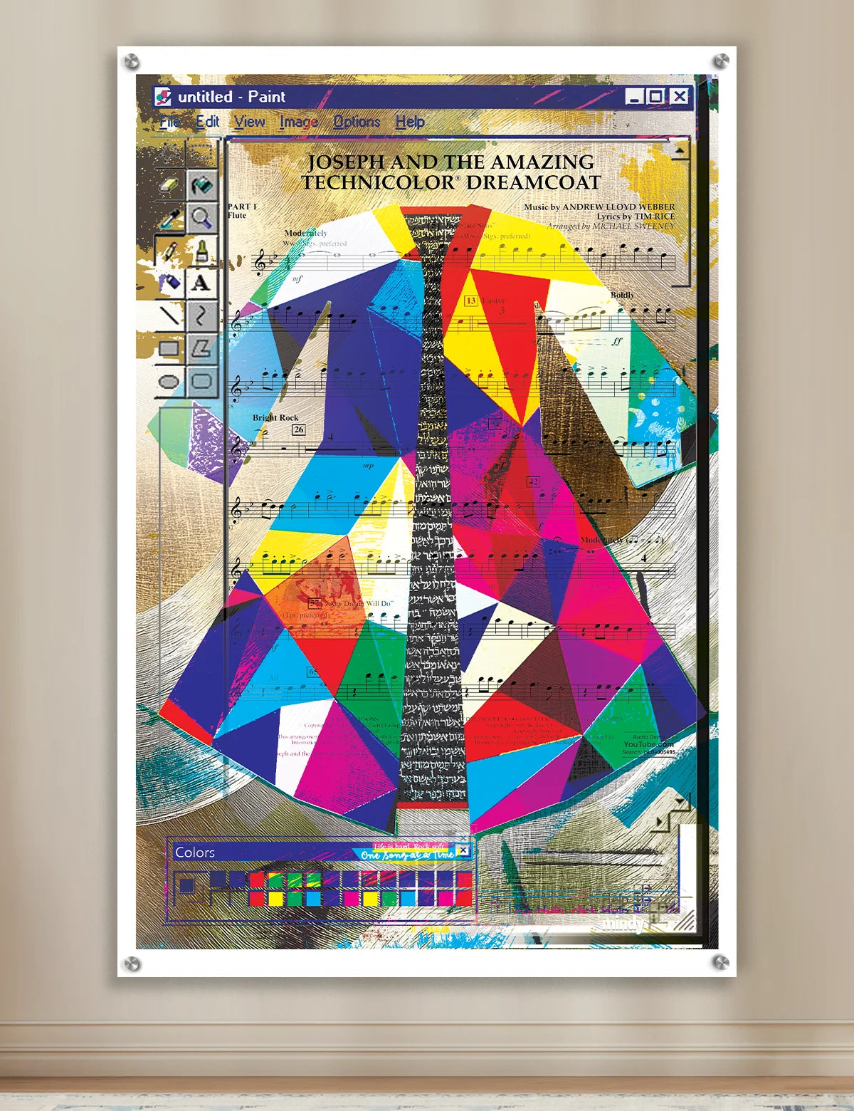 A framed art print featuring a colorful geometric coat design with musical sheet music elements, displayed on a beige wall.