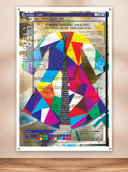 A metal art print depicting Jospeh and The Amazing Technicolor Dreamcoat design over sheet music, displayed against a beige wall above a wooden floor.