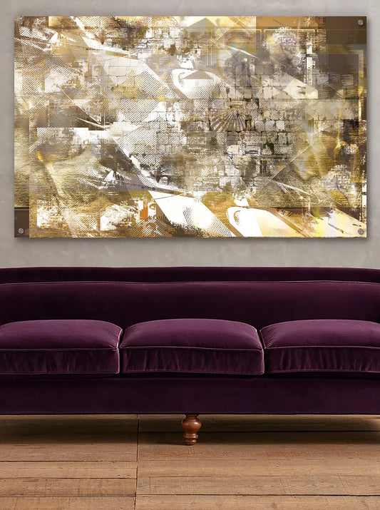 A gold western wall mural wall art print with a collage of beige, gold, white, and brown textures, displayed on a light gray wall above a purple velvet sofa.